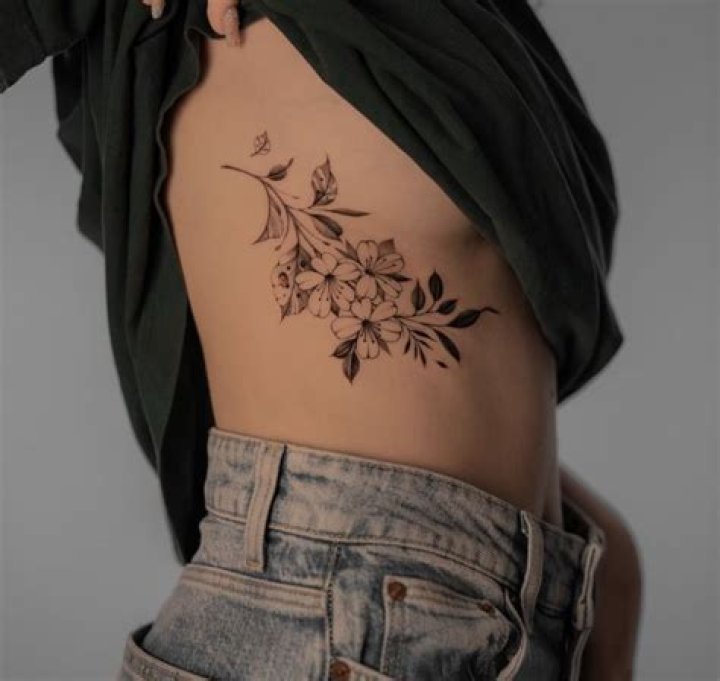 Exquisite Rib Flower Tattoo Designs: A Timeless Symbol Of Beauty